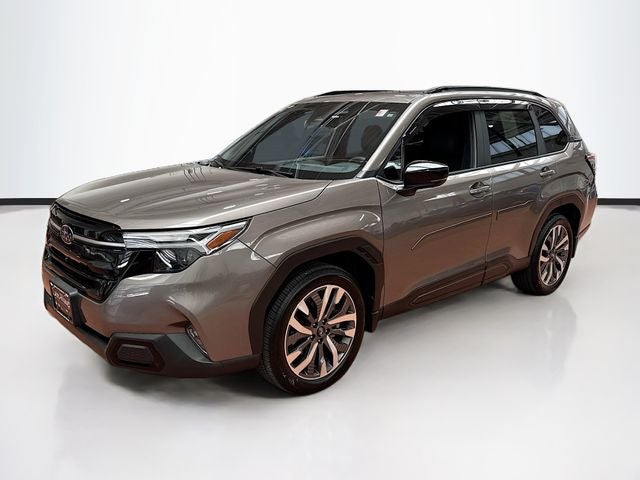 2025 Subaru Forester Touring in Brilliant Bronze Metallic — front three-quarter view